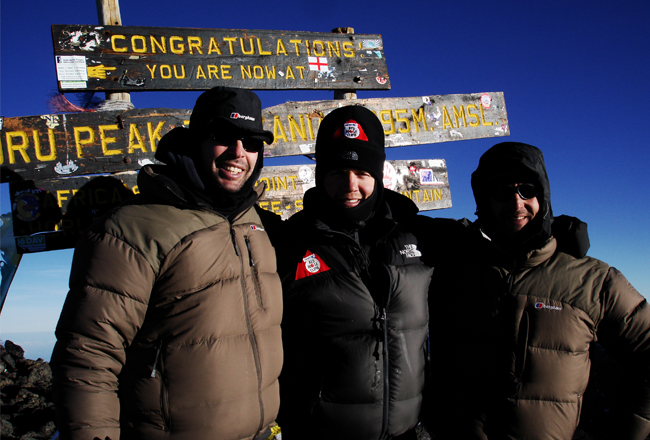 Charity Challenge founder, Simon Albert, at the summit of Kilimanjaro with Comic Relief Celebrity team