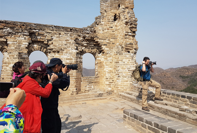 Tourists taking photos in China on the Great Wall 