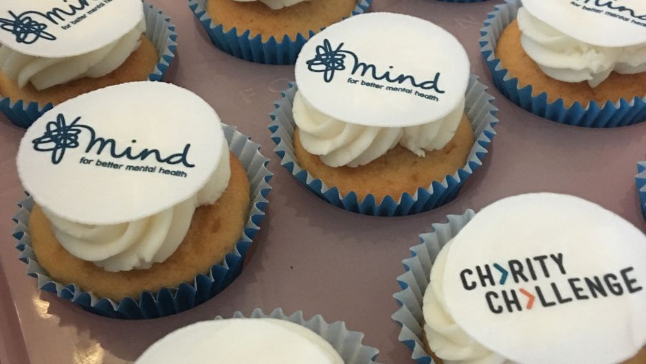 Homemade cupcakes with Mind and Charity Challenge logos decorating them. 
