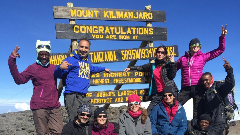 A group of trekkers on the summit 0f Mount Kilimanjaro, Tanzania