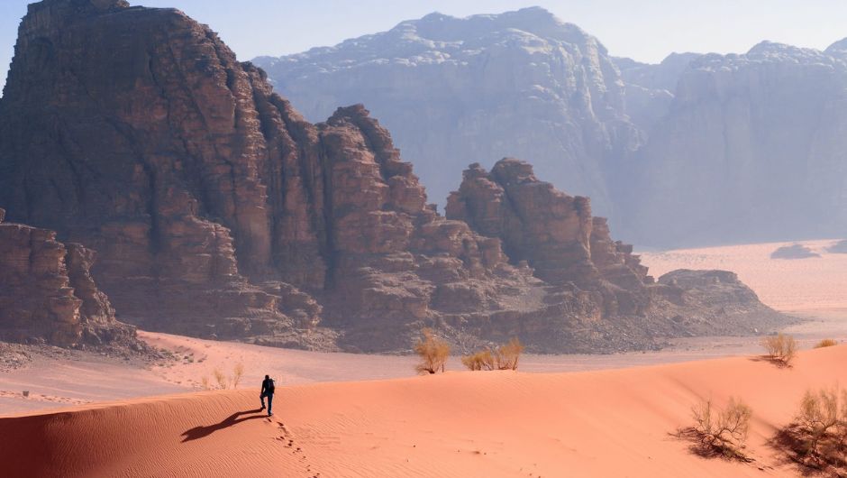 Lone Trekker on Sand Dune in Wadi Rum, Jordan
