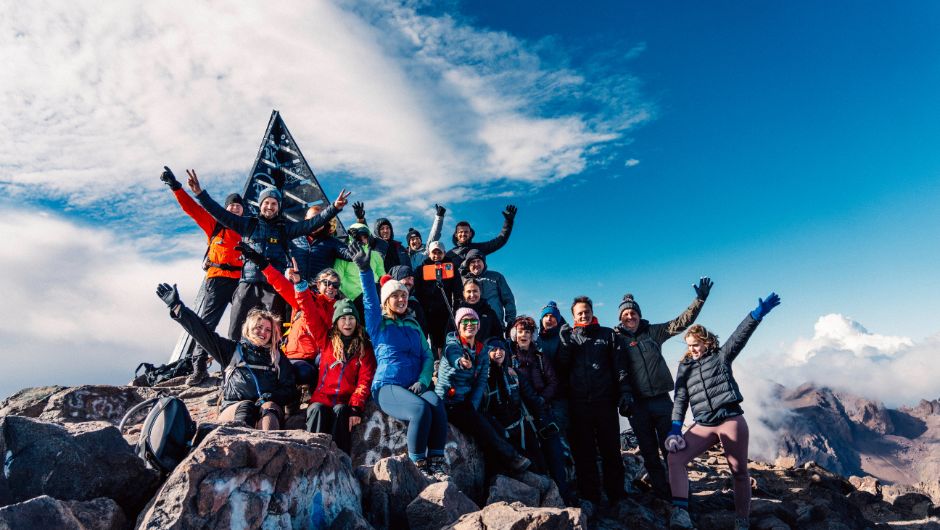Lloyds Banking Group Team hiking Mount Toubkal at summit together