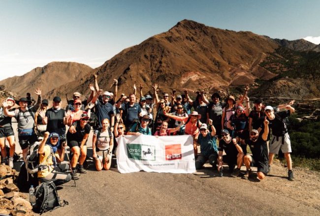 Lloyds Banking Group Team hiking Mount Toubkal together with flag