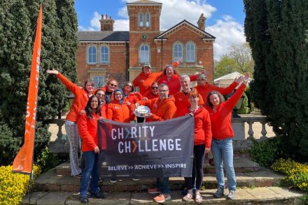 Team Charity Challenge holding Charity Challenge Flag