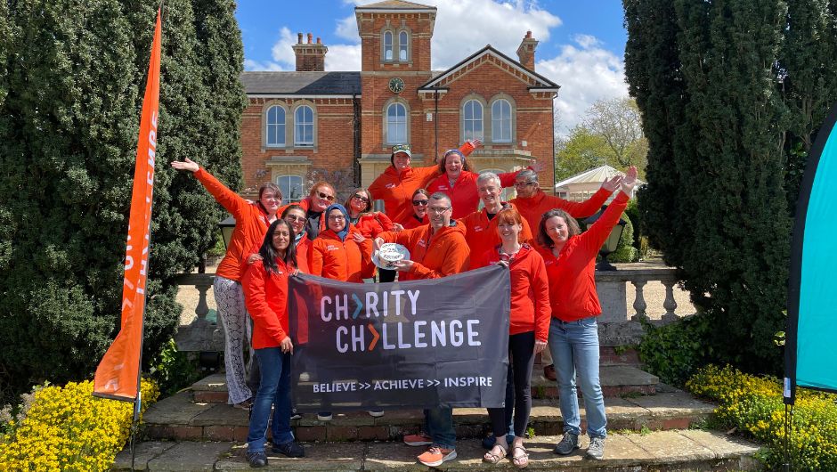 Team Charity Challenge holding Charity Challenge Flag