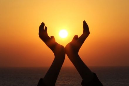 sunrise in persons hands