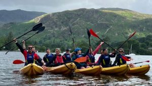 capital one employees enjoying kayaking during the lake district triple challenge