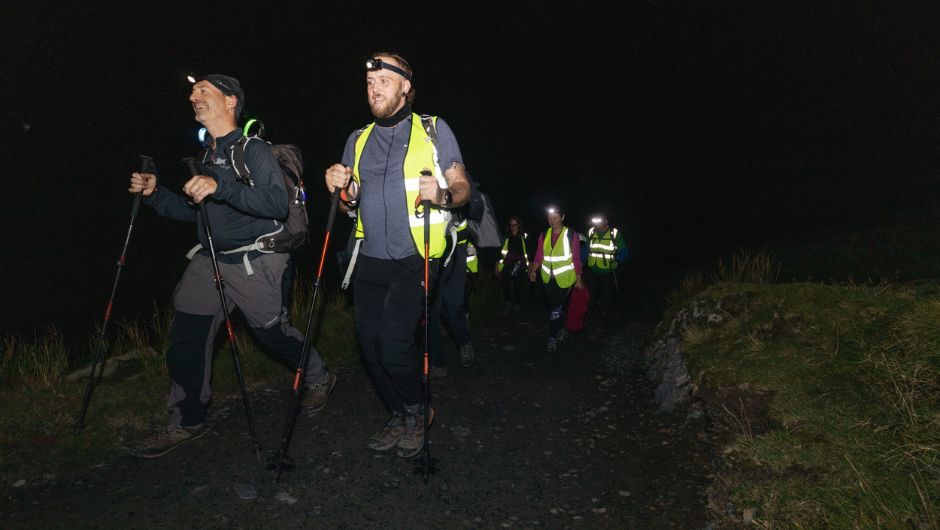 snowdon at night challengers trekking for charity with headtorches and trekking poles