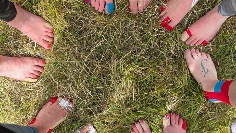 feet taped up with sporttape to prevent blisters