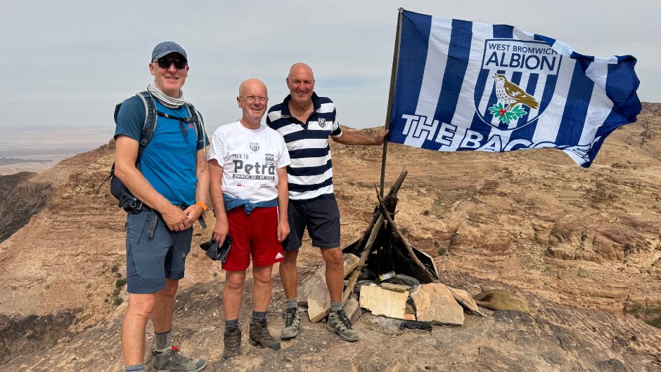The Albion Foundation Supporters on the Trek to Petra Charity Challenge with their West Bromwich Albion Flag