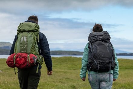 two trekkers hiking with their full packed daypacks