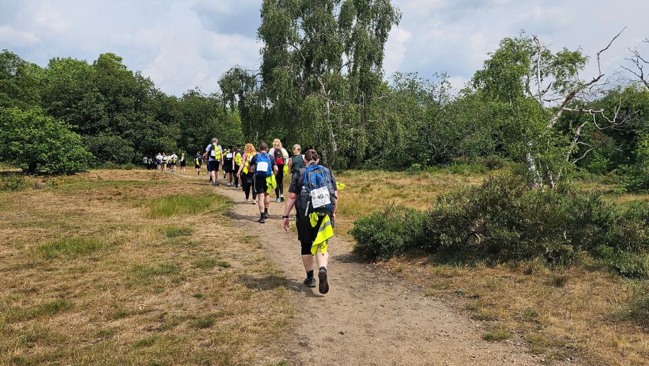 trekkers on the thames footpath challenge walking through London's greenery