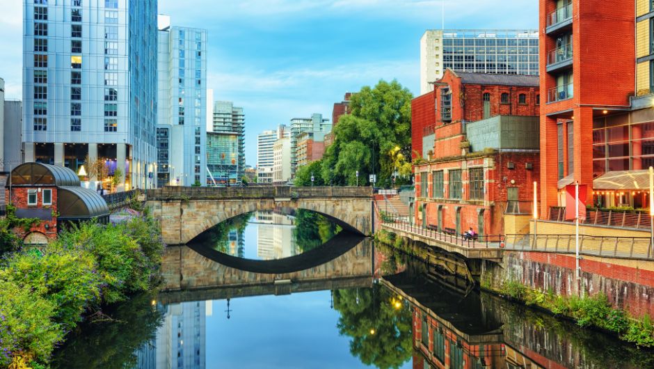 Historic canal going through Manchester city on a clear day 