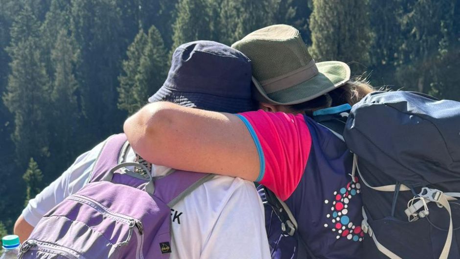 charity challengers celebrating with a hug