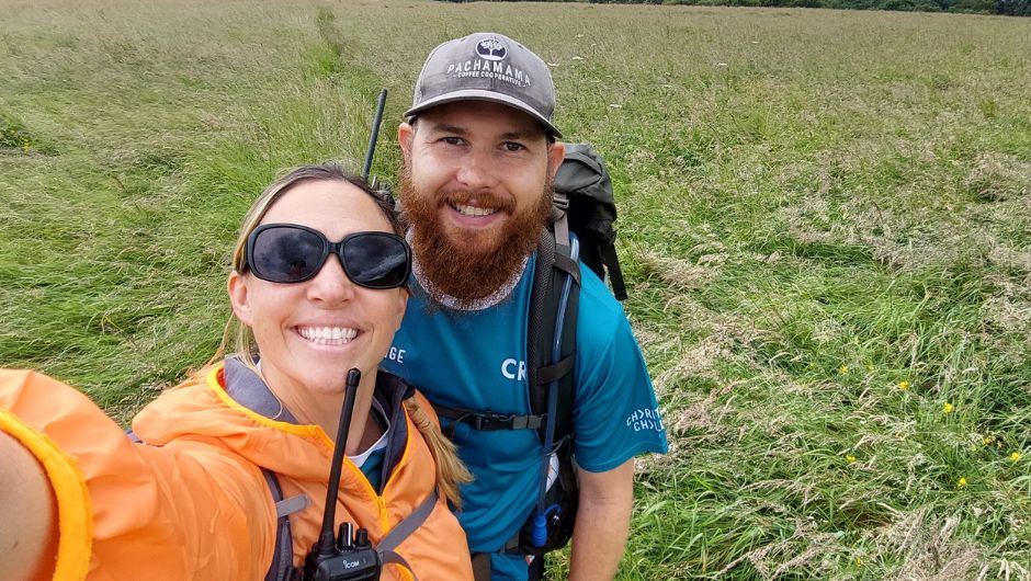 elliot swinney smiling with his wife, whilst both working as leaders