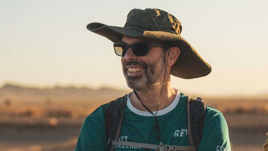 charity challenge co-founder and director, Simon Albert, smiling whilst on the CoppaTrek! with Gi Sahara challenge in 2025.