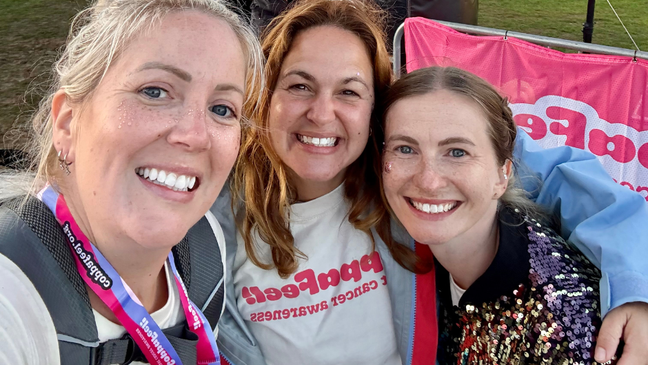 Three people smiling for a selfie, after a CoppaTrek! challenge.