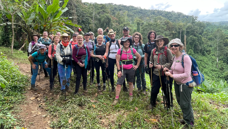A group of trekkers smiling together in the Costa Rican rainforest whilst on a Charity Challenge group adventure.