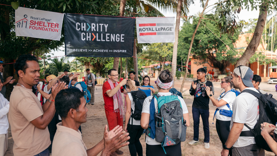Charity Challenge participants receiving their medals at the finish line of their Cambodia Challenge.