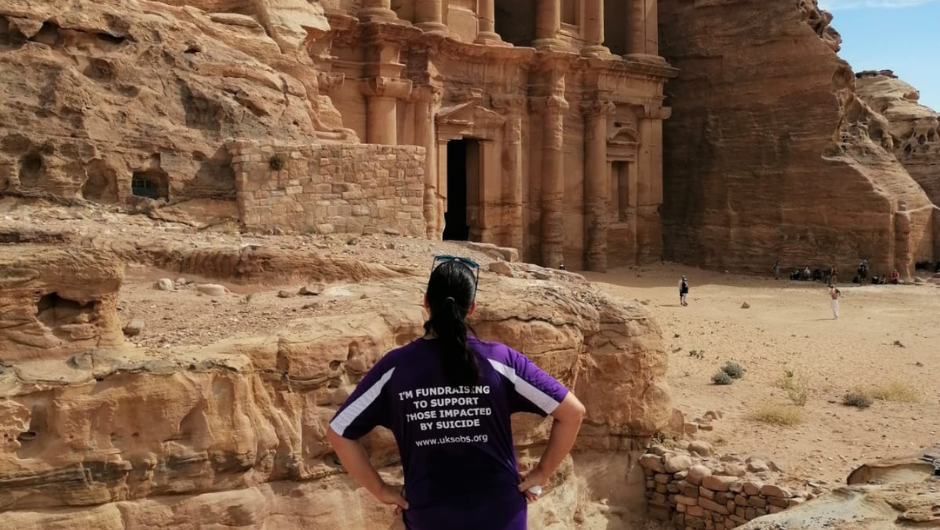 Sharon wearing her Survivors of Bereavement by Suicide T-shirt at the site of The Treasury in Petra, Jordan during the Trek to Petra Charity Challenge.