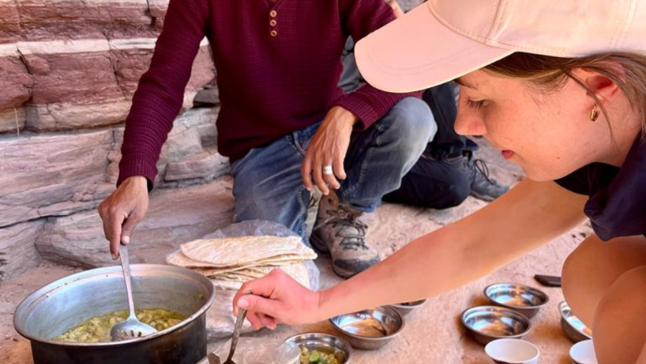 A person serving themselves some local food during their overseas trek with Charity Challenge.