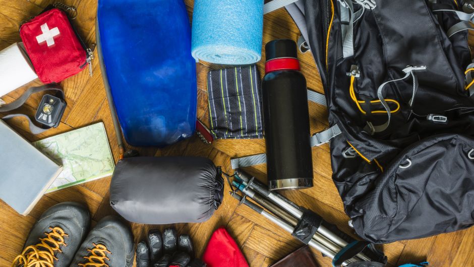 contents of a trekking daypack laid out before packing up