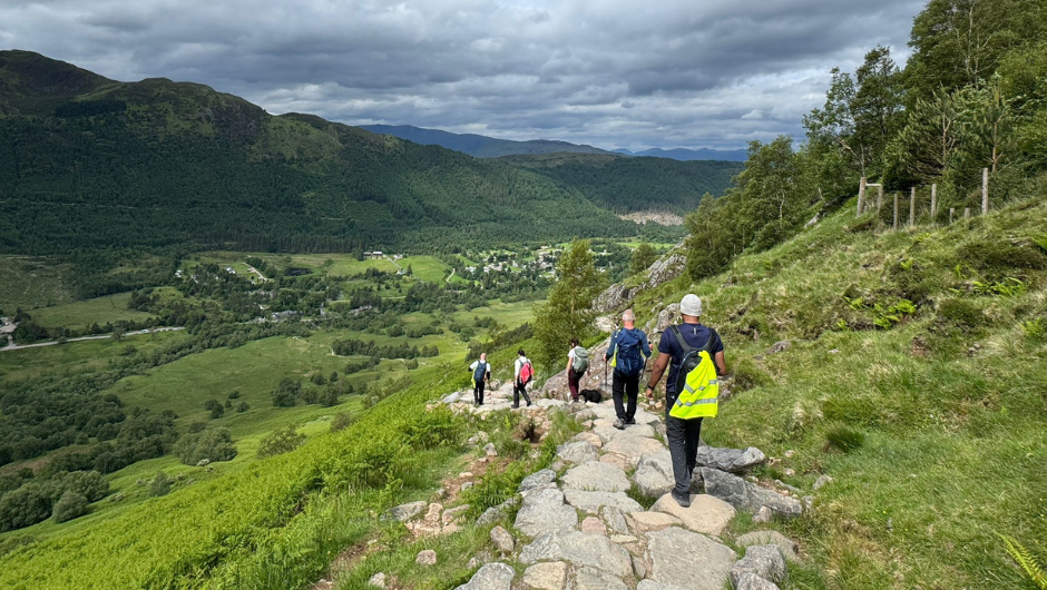 People trekking downhill during the national three peaks challenge